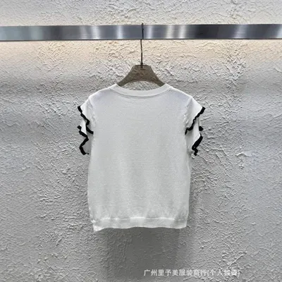 White Knit Top With Black Ruffle Sleeves Casual Style