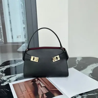 Black Leather Handbag With Gold Locks Classic Design