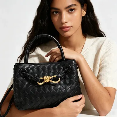 Bottega Veneta Mini Pouch Black Woven Leather Handbag